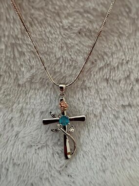 20 inch Silver Cross Pendant Necklace with Blue Stone and Rose Accent